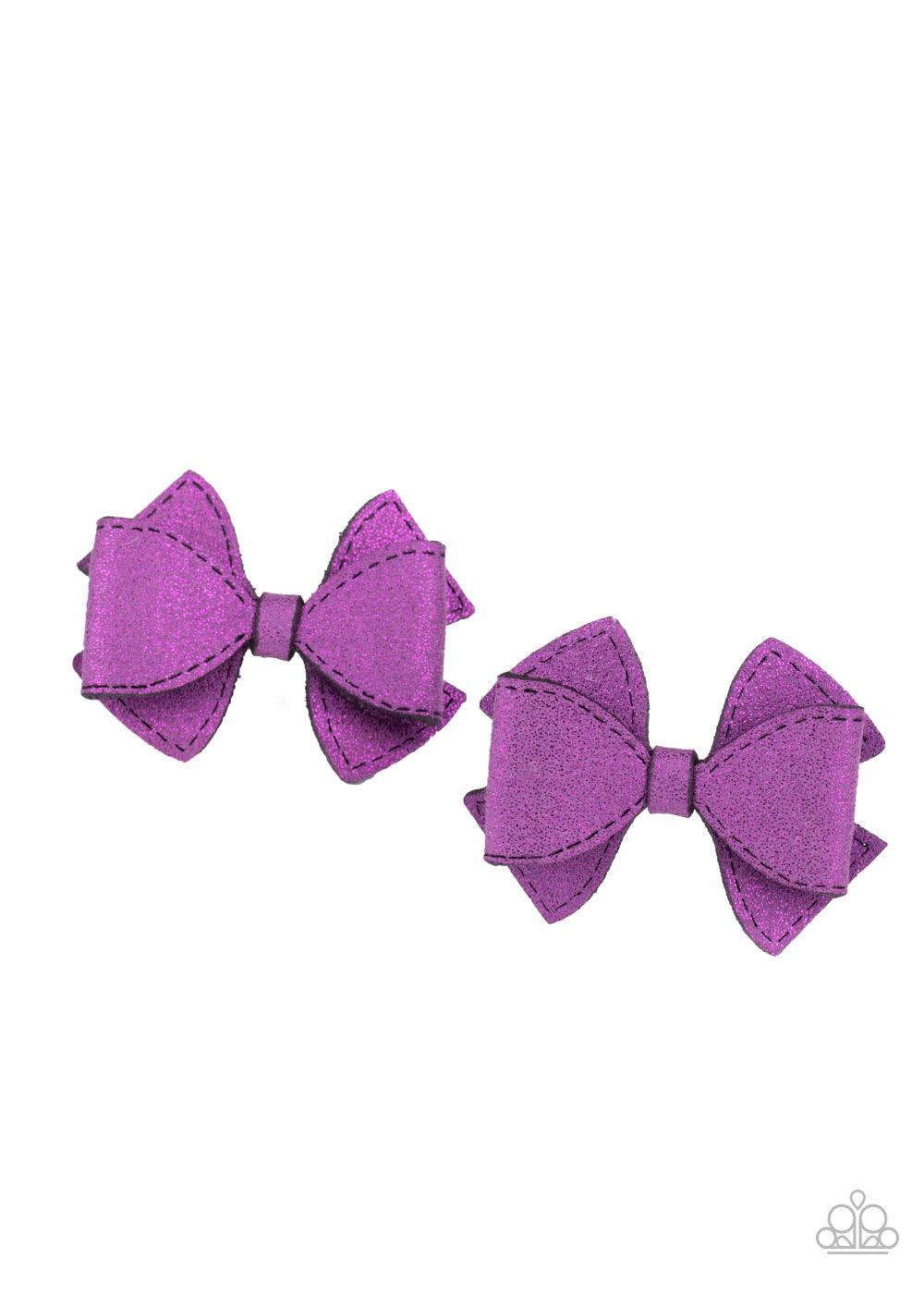 Paparazzi Accessories Don’t BOW It! - Purple Dusted in purple glitter, two purple suede ribbons delicately knot into a pair of colorful hair bows. Each bow features a standard hair clip on the back. Sold as one pair of hair clips. Hair Accessories