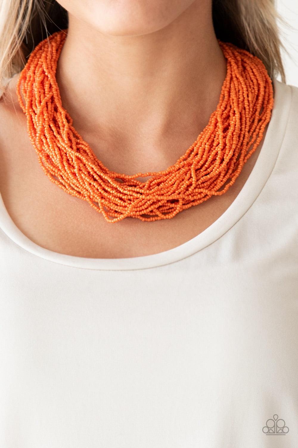 Paparazzi Accessories The Show Must CONGO On - Orange Infused with two bold silver fittings, countless strands of vivacious orange seed beads drape below the collar for a seasonal look. Features an adjustable clasp closure. Jewelry