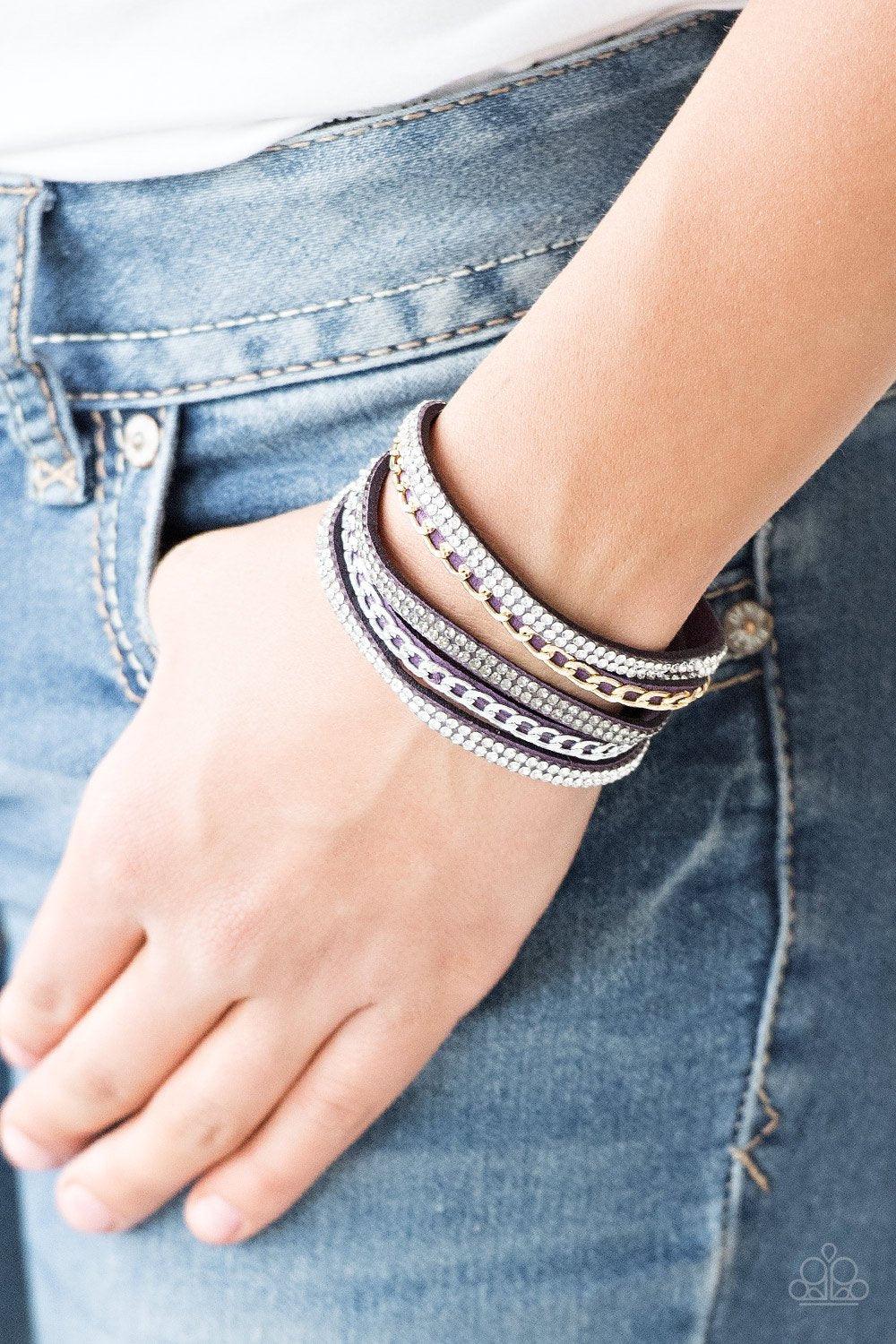 Paparazzi Accessories Fashion Fiend - Purple Glassy white and smoky rhinestones are encrusted along strands of purple suede. Glistening silver and gold chains are added to the bands, adding edgy industrial shimmer to the sassy palette. Features an adjusta
