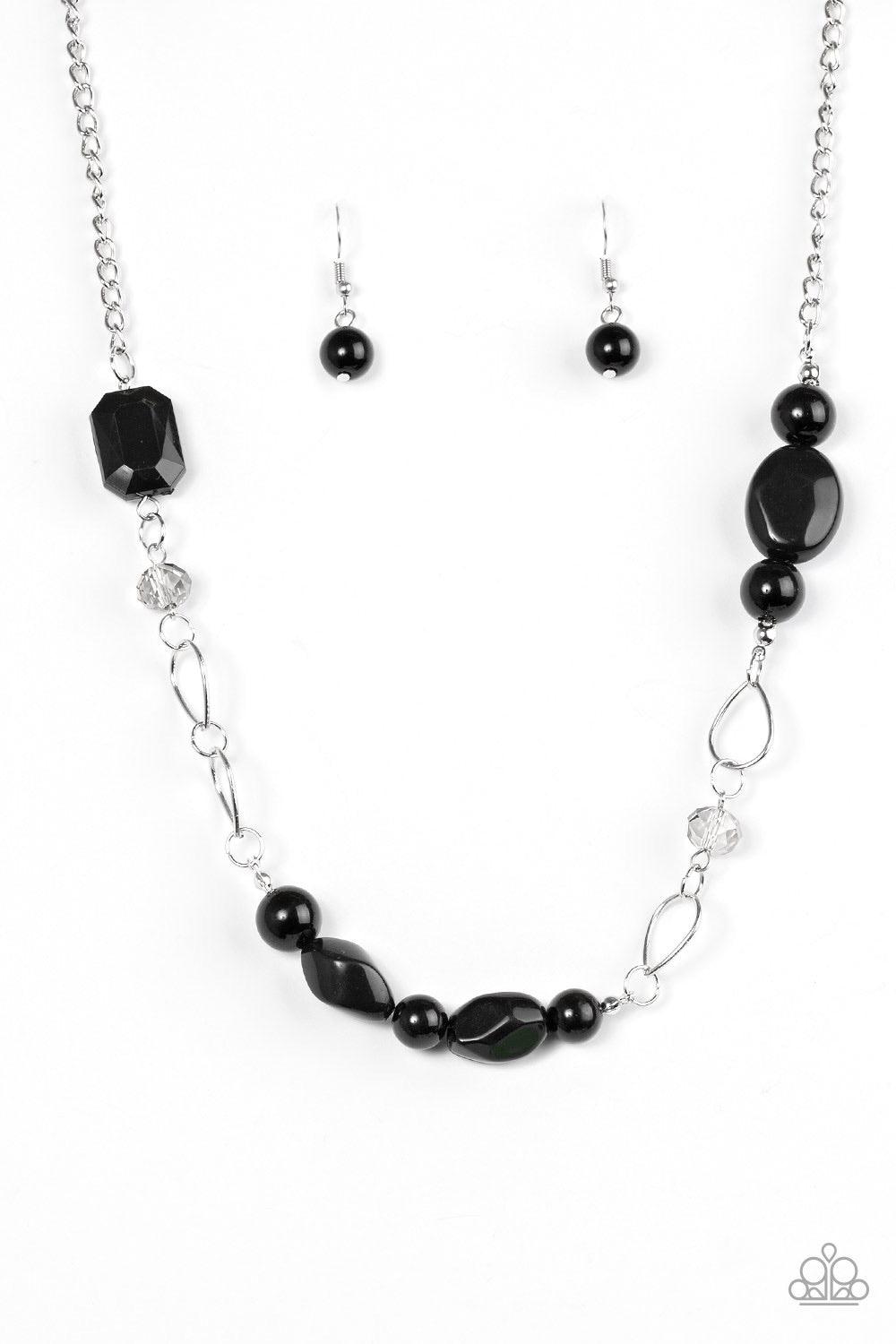 Paparazzi Accessories Bean Away - Black Featuring polished and glassy finishes, black beads trickle below the collar in a refined fashion. Faceted crystal-like beads and teardrop shaped frames are sprinkled between the colorful accents for a beaming finis