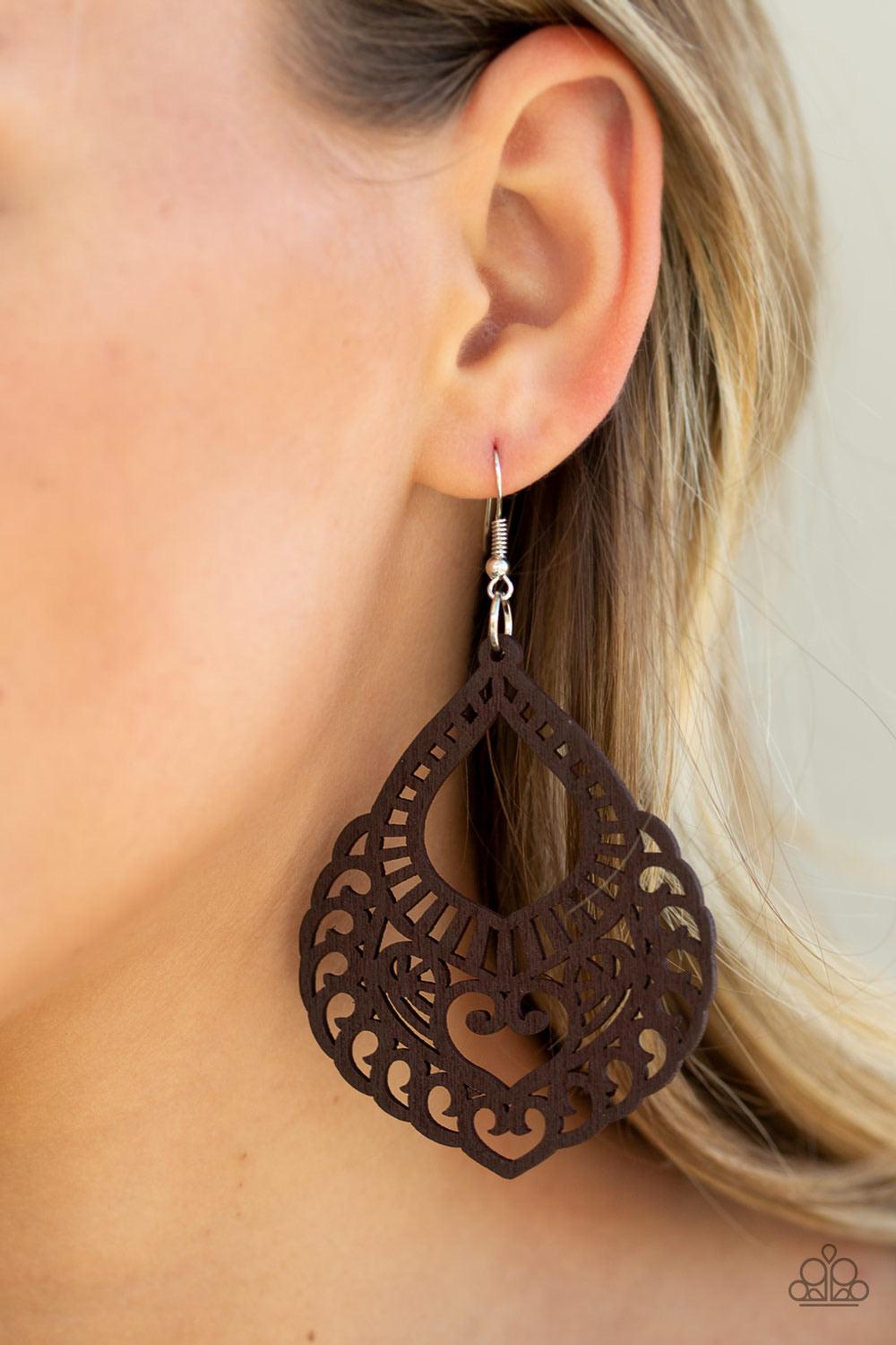 Paparazzi Accessories If You WOOD Be So Kind - Brown Painted in a brown finish, an airy wooden frame swirling with filigree detail swings from the ear for a seasonal look. Earring attaches to a standard fishhook fitting. Sold as one pair of earrings. Jewe