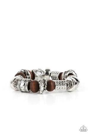 Paparazzi Accessories Exploring The Elements - Brown Stamped, studded, and embossed in tribal inspired patterns, a collection of chunky silver beads join earthy wooden beads along a stretchy band around the wrist for an earthy flair. Sold as one individua