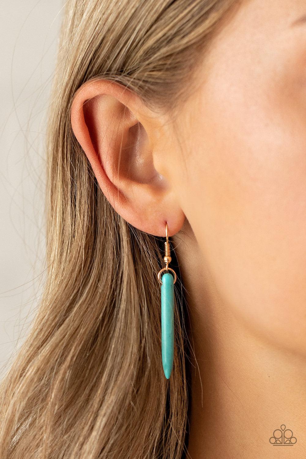 Paparazzi Accessories PRIMITIVE And Proper - Blue Capped in glistening gold fittings, refreshing turquoise stone tusk-like bars haphazardly dangle from two dainty gold chains, creating an earthy fringe at the bottom of a lengthened gold chain. Features an