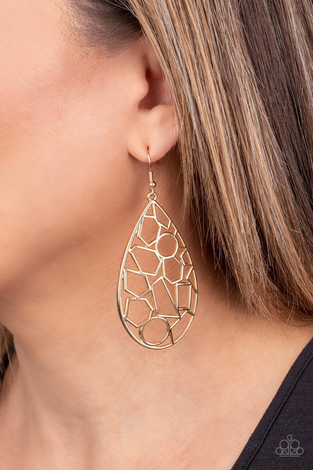 Paparazzi Accessories Reshaped Radiance - Gold An abstract collection of airy gold circles, rectangles, and trapezoidal shapes collide together, coalescing into a shattered lure. Earring attaches to a standard fishhook fitting. Sold as one pair of earring