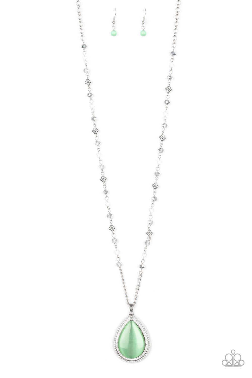 Paparazzi Accessories Fashion Flaunt - Green Encrusted in rows of glassy white rhinestones, an imperfect silver teardrop frame is encrusted in a glowing green cat's eye stone. The ethereal pendant swings from the bottom of a lengthened silver chain dotted
