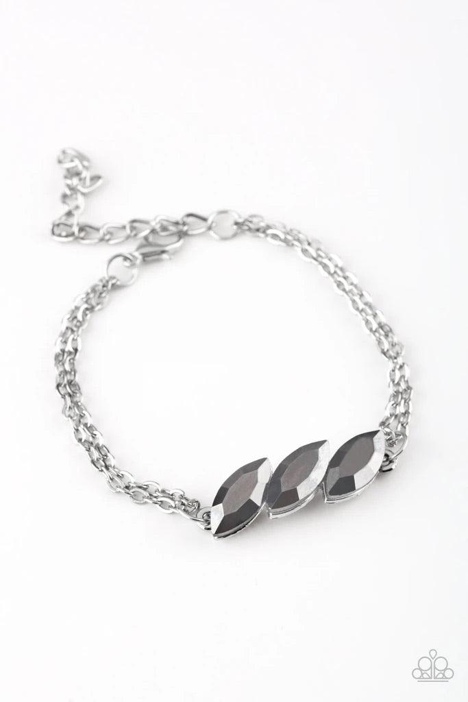 Paparazzi Accessories Pretty Priceless - Silver Featuring regal marquise-cuts, a trio of glittery hematite rhinestones join across the center of the wrist for a timeless look. Features an adjustable clasp closure. Sold as one individual bracelet. Jewelry