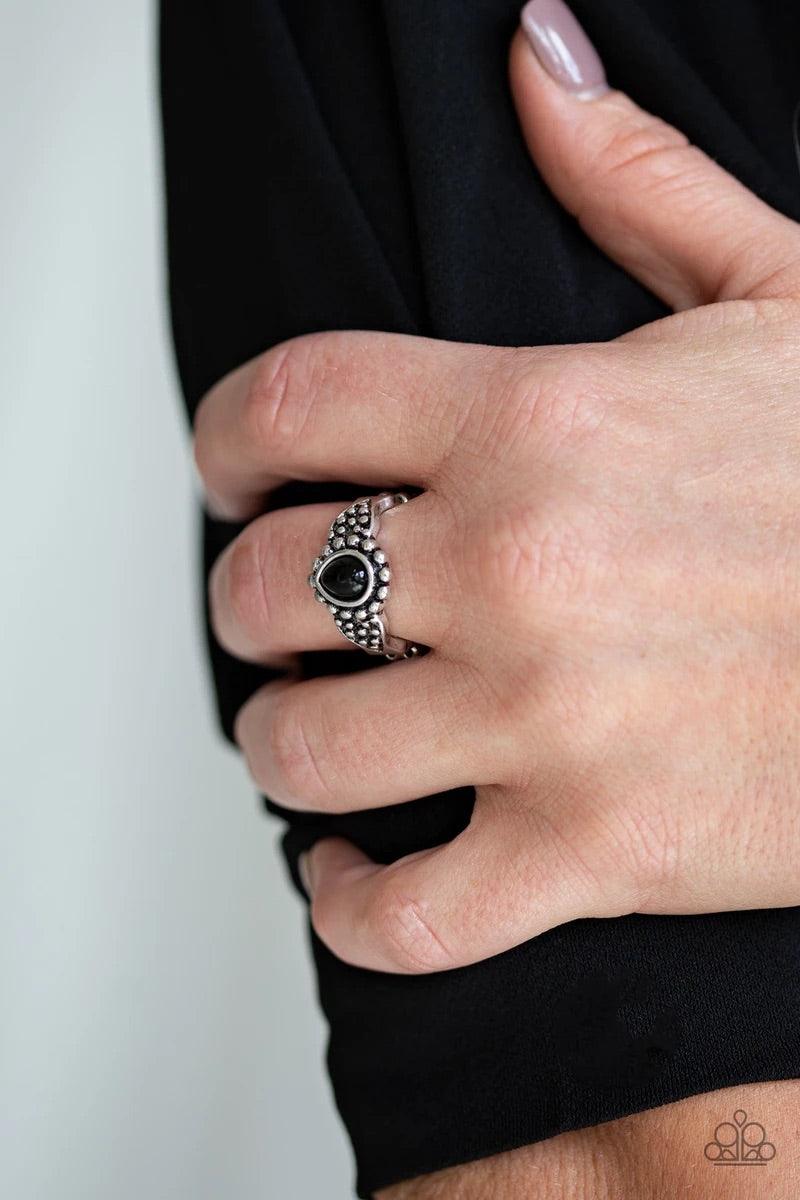 Paparazzi Accessories Pep Talk - Black A teardrop black bead is pressed into the center of a dainty silver band radiating with studded patterns for a seasonal look. Features a dainty stretchy band for a flexible fit. Sold as one individual ring. Jewelry
