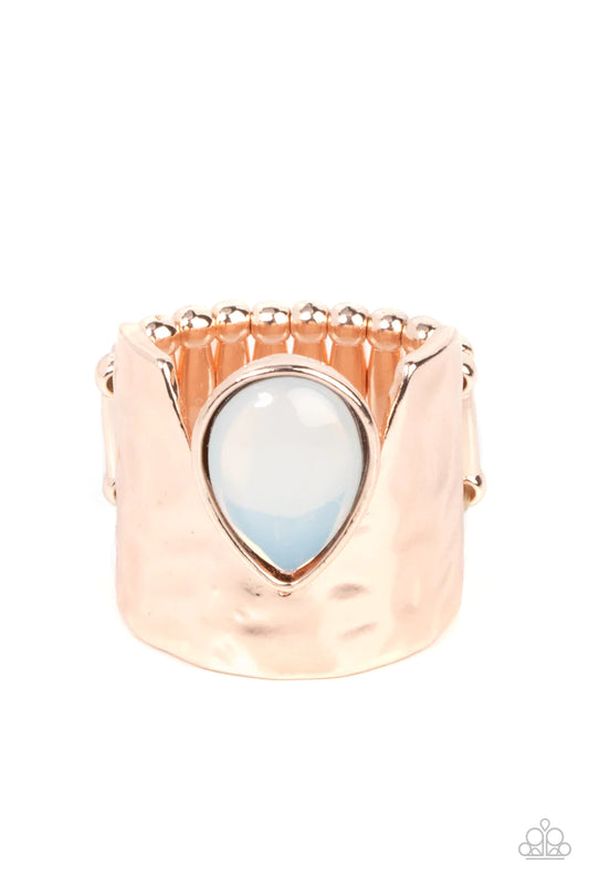 Paparazzi Accessories Optimistically Oracle - Rose Gold A dewy opal teardrop bead is nestled inside the angular cut of a hammered rose gold band, resulting in an ethereal centerpiece atop the finger. Features a stretchy band for a flexible fit. Sold as on
