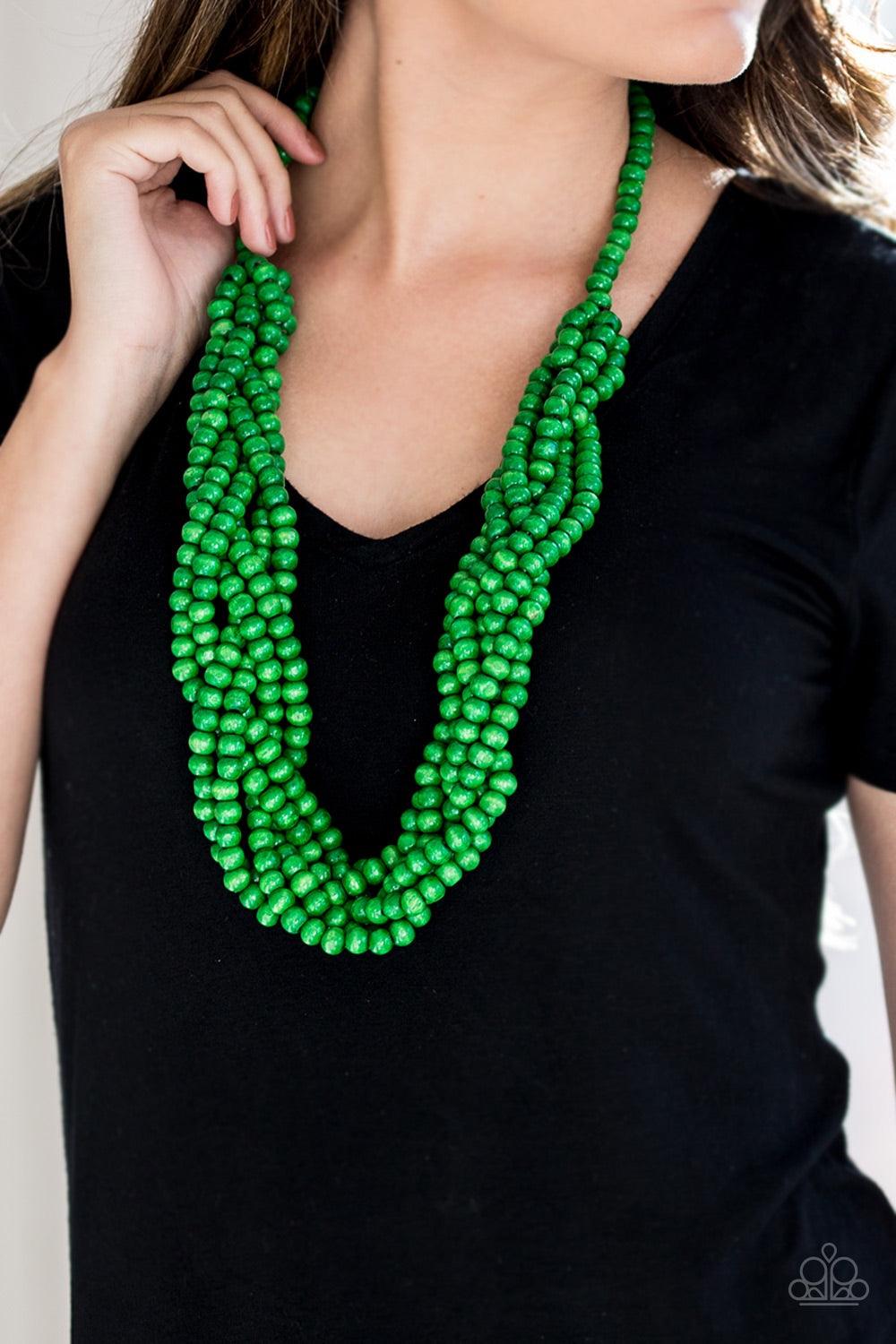 Paparazzi Accessories Tahiti Tropic - Green Brushed in a refreshing green finish, strands of vivacious wooden beads subtly twist across the chest for a summery look. Jewelry