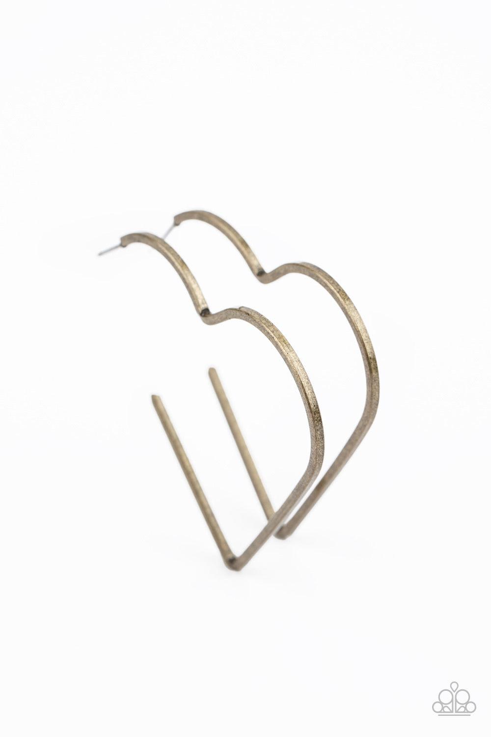 Paparazzi Accessories I HEART A Rumor - Brass Brushed in a rustic antiqued finish, a flat brass bar delicately bends into an airy heart frame for a flirtatious finish. Earring attaches to a standard post fitting. Hoop measures approximately 2" in diameter