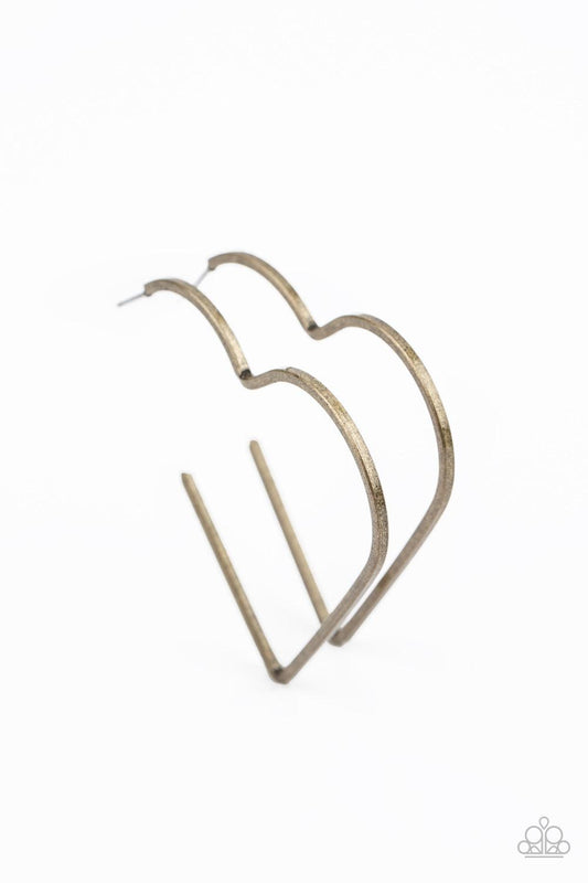 Paparazzi Accessories I HEART A Rumor - Brass Brushed in a rustic antiqued finish, a flat brass bar delicately bends into an airy heart frame for a flirtatious finish. Earring attaches to a standard post fitting. Hoop measures approximately 2" in diameter