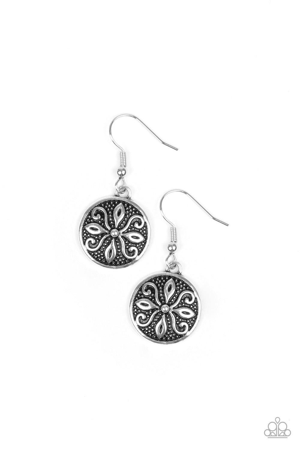 Paparazzi Accessories Tropical Trance ~Silver Brushed in an antiqued shimmer, a dainty silver disc is embossed in a frilly tactile pattern for a seasonal flair. Earring attaches to a standard fishhook fitting.