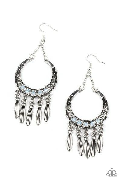Paparazzi Accessories Day to DAYDREAM - Blue A row of blue opal rhinestones adorns the center of a studded silver half moon frame. Tassels of classic and textured silver beads cascade from the bottom of the frame, creating a dreamy fringe. Earring attache