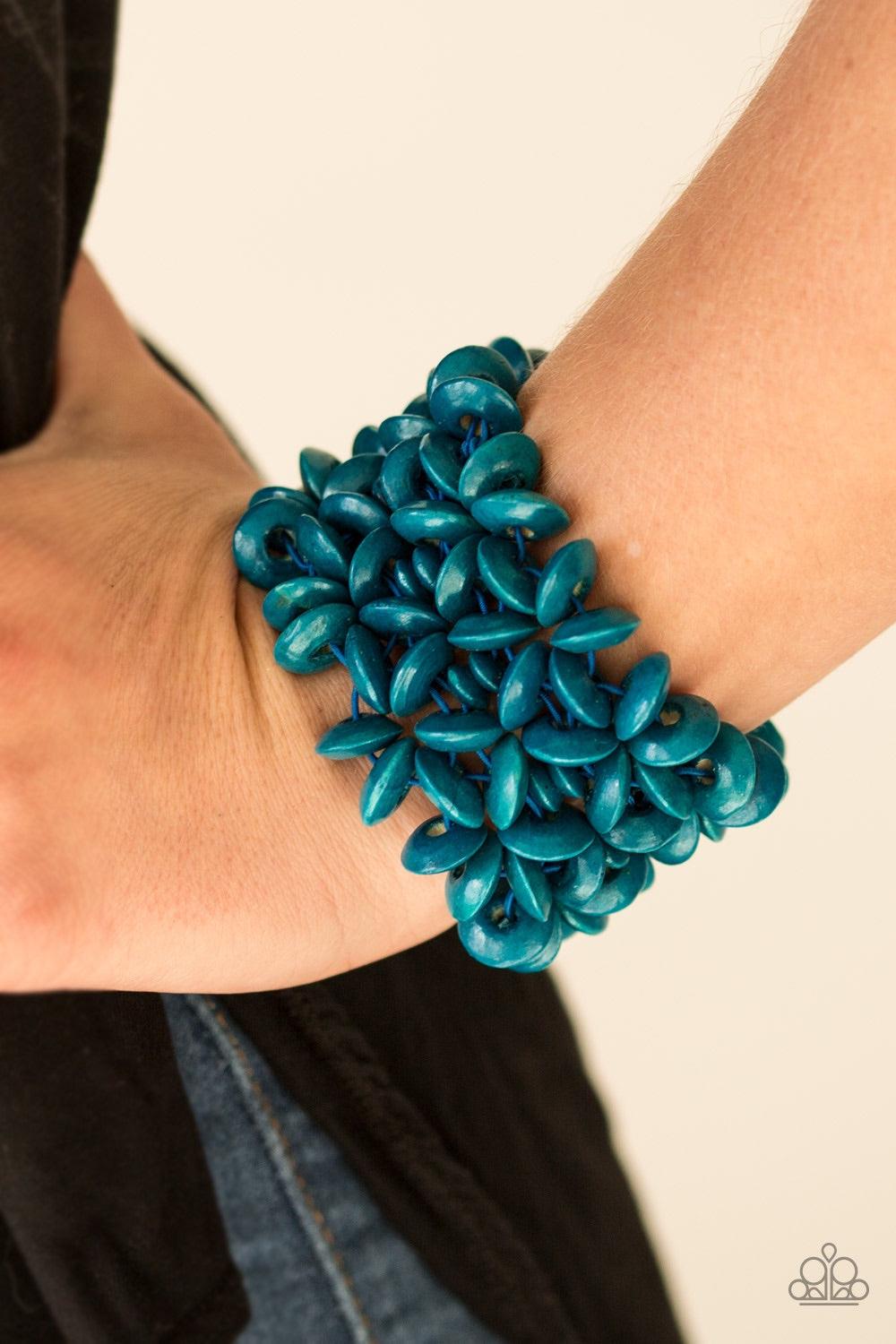 Paparazzi Accessories Hawaii Haven - Blue Refreshing blue wooden accents are threaded along elastic stretchy bands, creating summery floral patterns across the wrist for a seasonal look. Jewelry