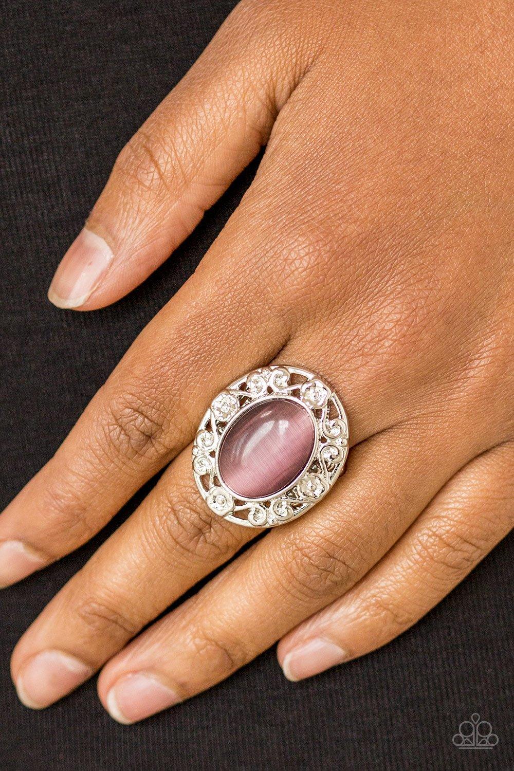 Paparazzi Accessories Moonlit Marigold - Purple Shimmery floral-like filigree swirls around a glowing purple moonstone center, creating a whimsical centerpiece atop the finger. Features a stretchy band for a flexible fit. Sold as one individual ring. Jewe