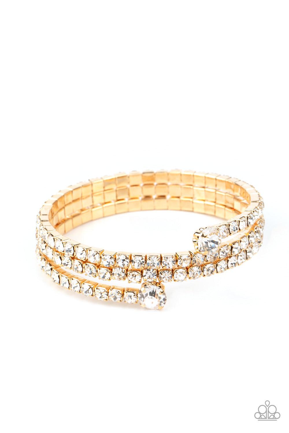 Paparazzi Accessories After Party Princess - Gold Featuring two oversized white rhinestone fittings, a glittery collection of white rhinestone encrusted gold frames are threaded along a gold wire around the wrist, creating a glamorous infinity wrap bracel
