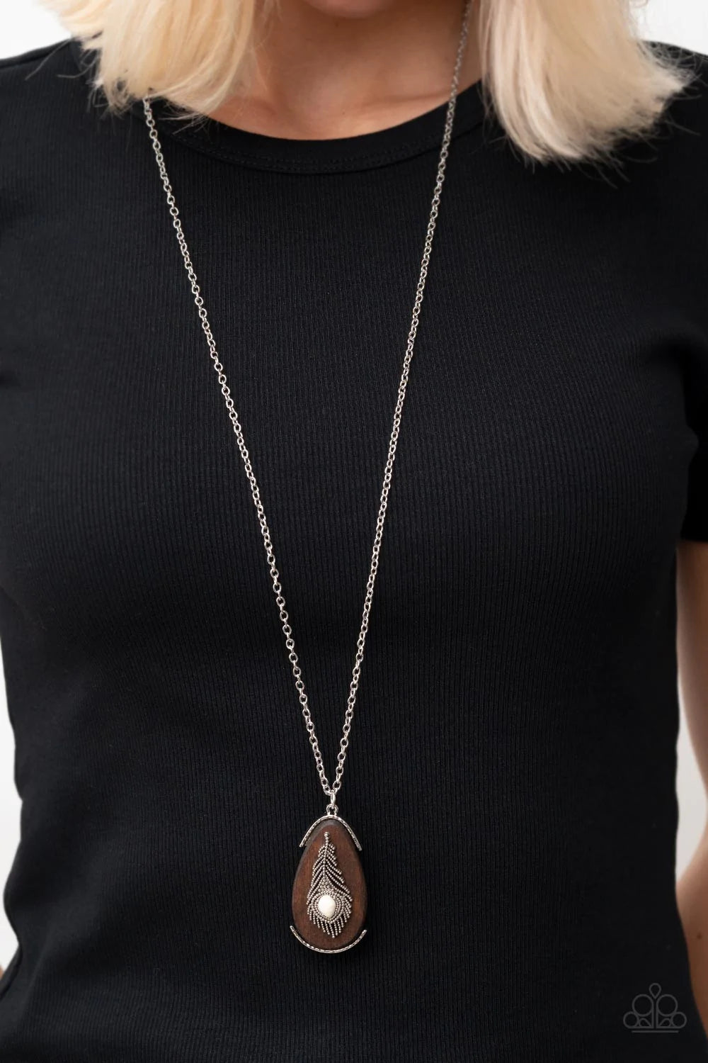 Paparazzi Accessories Personal FOWL - White A teardrop white stone adorns a studded silver feather that embellishes an oversized wooden pendant at the bottom of an extended silver chain, resulting in a whimsically rustic pendant. Features an adjustable cl