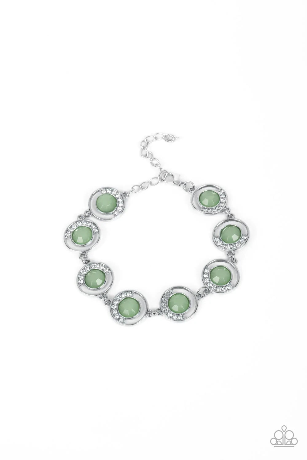 Paparazzi Accessories Twinkling Trajectory - Green An arc of glassy white rhinestones curls around one side of an opaque Basil gem inside a dainty silver hoop. The twinkly frames delicately link around the wrist, creating a mystical centerpiece. Features