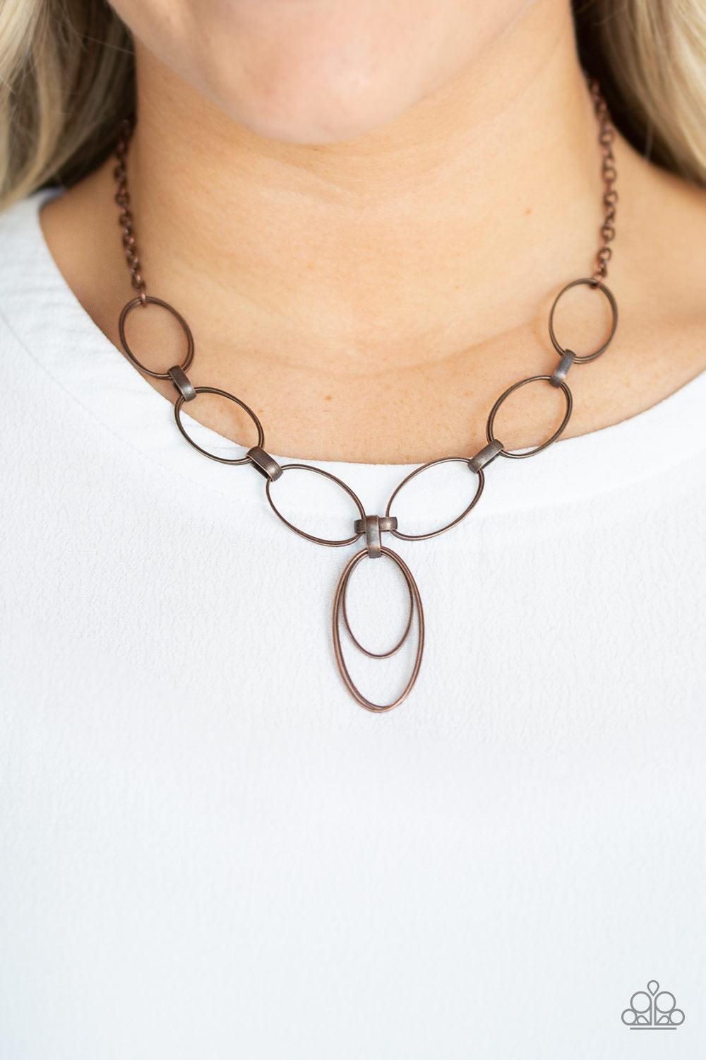 Paparazzi Accessories All OVAL Town - Copper Varying in size, a collection of oval frames swing from the bottom of a strand of double-linked oval frames, creating a casual pendant below the collar. Features an adjustable clasp closure. Jewelry