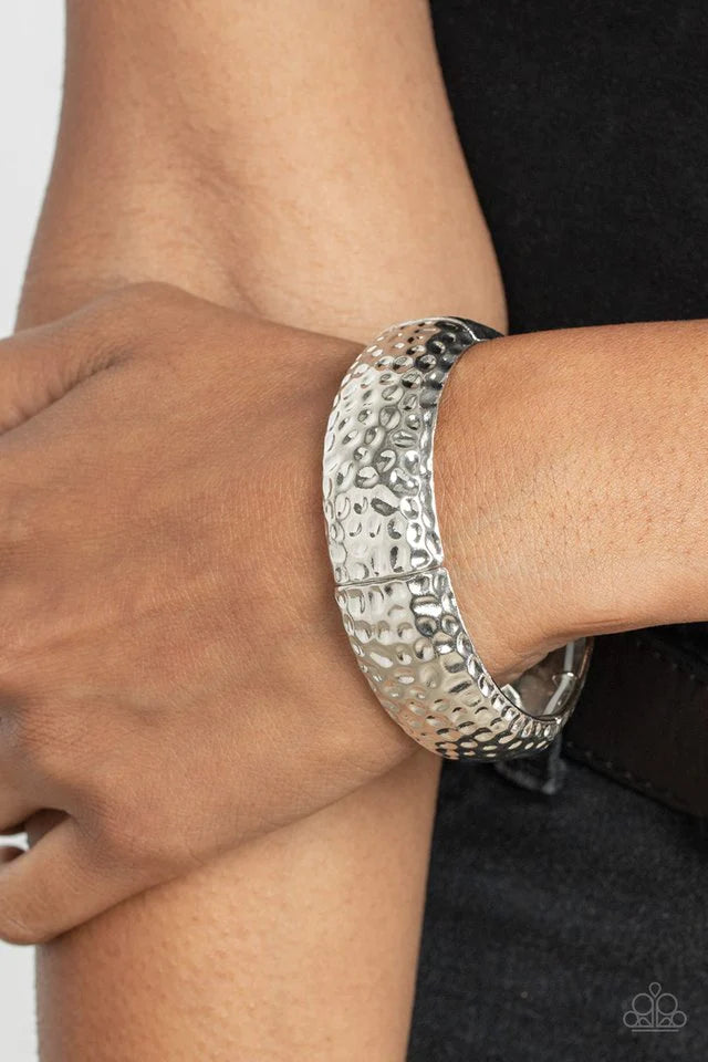 Paparazzi Accessories Come Under The Hammer - Silver Hammered in rustic textures, curved silver rectangular frames are threaded along stretchy bands around the wrist for an artisan inspired look. Sold as one individual bracelet. Jewelry