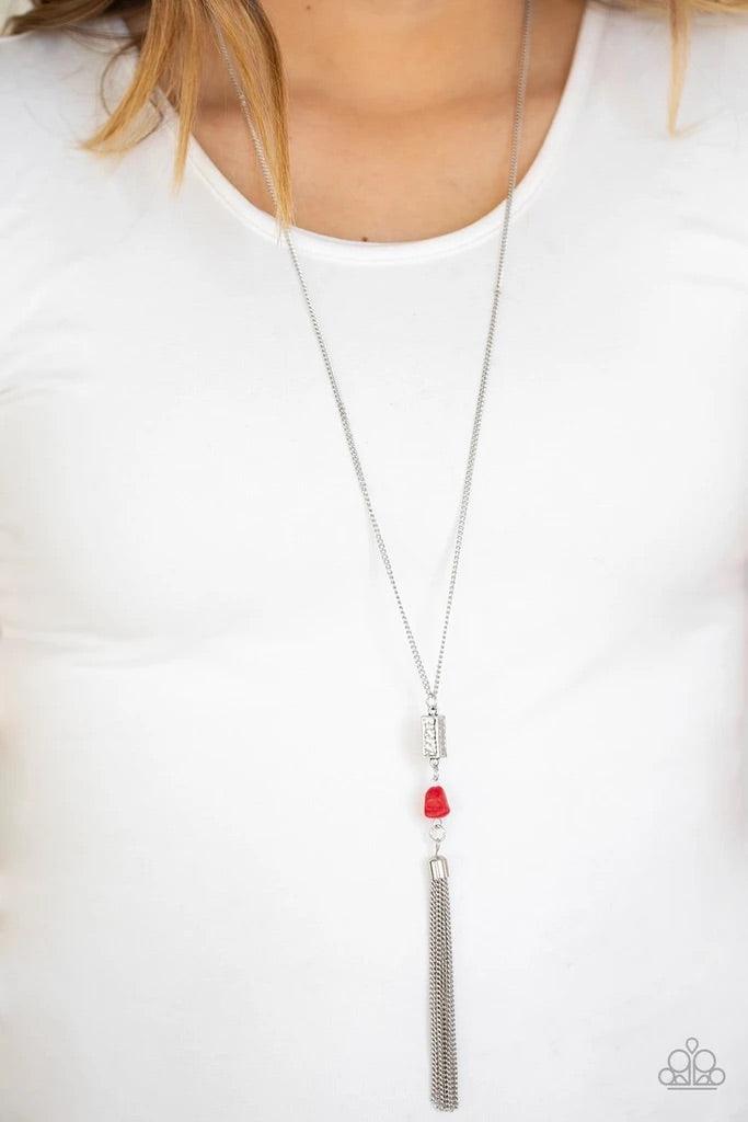 Paparazzi Accessories Wild Horse Wonder - Red Infused with a lengthened silver chain, a shimmery silver tassel swings from the bottom of a stacked red stone and hammered silver frame for a seasonal look. Features an adjustable clasp closure. Sold as one i