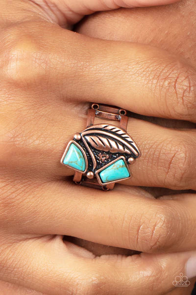 Paparazzi Accessories Make the NEST of It - Copper Asymmetrical turquoise stones adorn the front of an antiqued copper frame adorned in a coppery feather, creating a rustic centerpiece atop the finger. Features a stretchy band for a flexible fit. Sold as