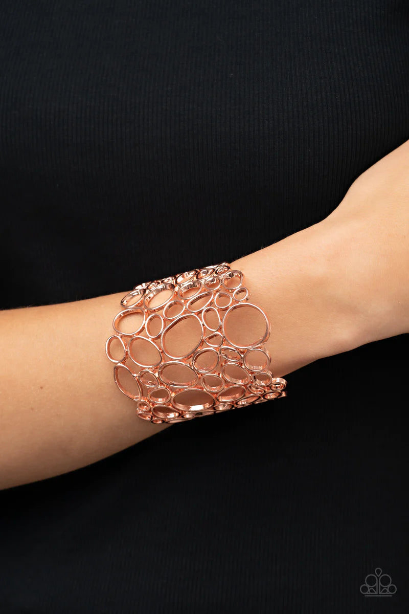 Paparazzi Accessories All Turned Around - Copper Varying in shape and size, asymmetrical shiny copper circular frames delicately connect into an effervescently abstract cuff around the wrist. Sold as one individual bracelet. Jewelry