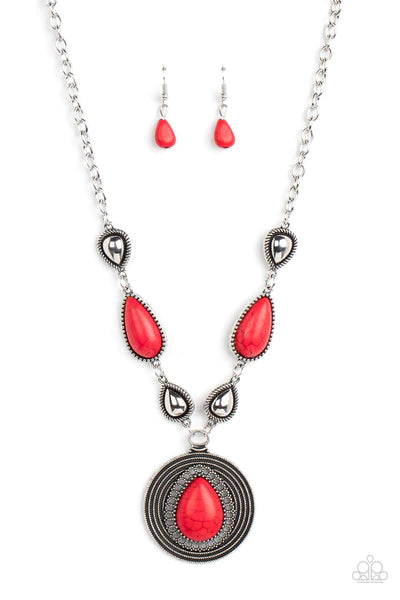 Paparazzi Accessories Saguaro Soul Trek - Red Bordered in studded and spun silver textures, shiny silver teardrops alternate with red stone frames at the bottom of a silver chain. Bordered in whirls of studded details, an oversized red teardrop stone is p