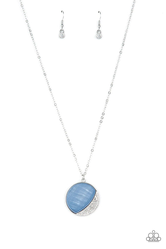 Paparazzi Accessories Oceanic Eclipse - Blue A refreshingly blue Spring Lake shell-like pendant is eclipsed in a half moon silver frame that is encrusted in sparkly white rhinestones, creating a shimmery display below the collar. Features an adjustable cl