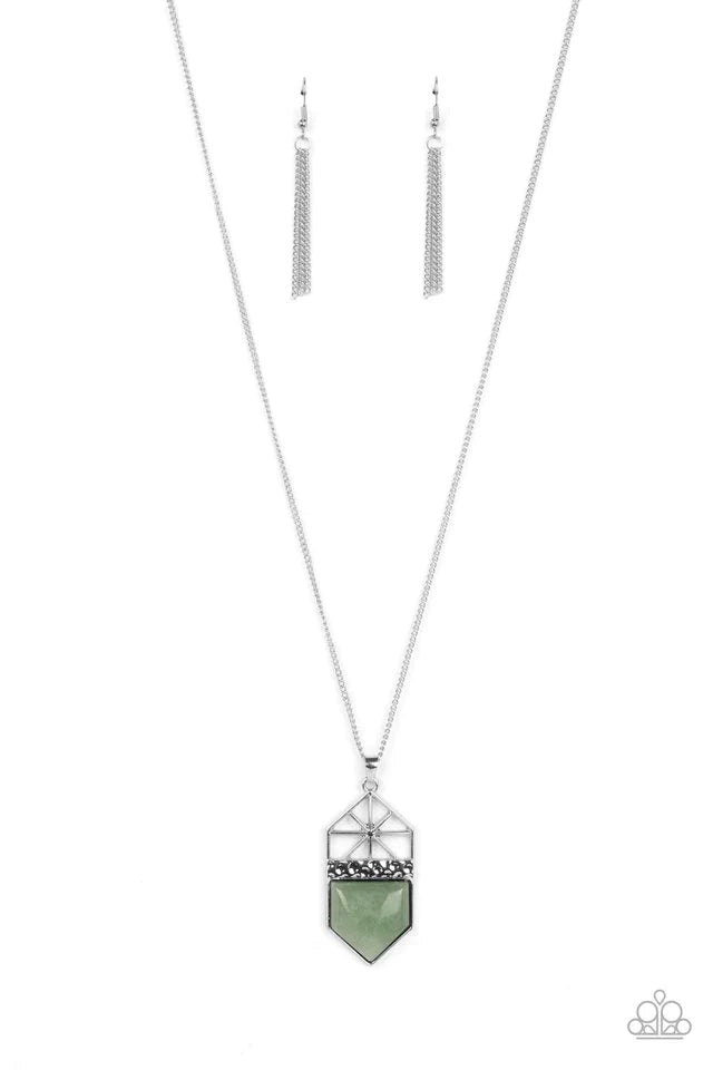 Paparazzi Accessories Trailblazing Talisman - Green This lucky charm features a polished jade stone that lies below a hammered silver metal bar and a shiny silver starburst top. The earthy pendant swings from the bottom of a lengthened silver chain, resul