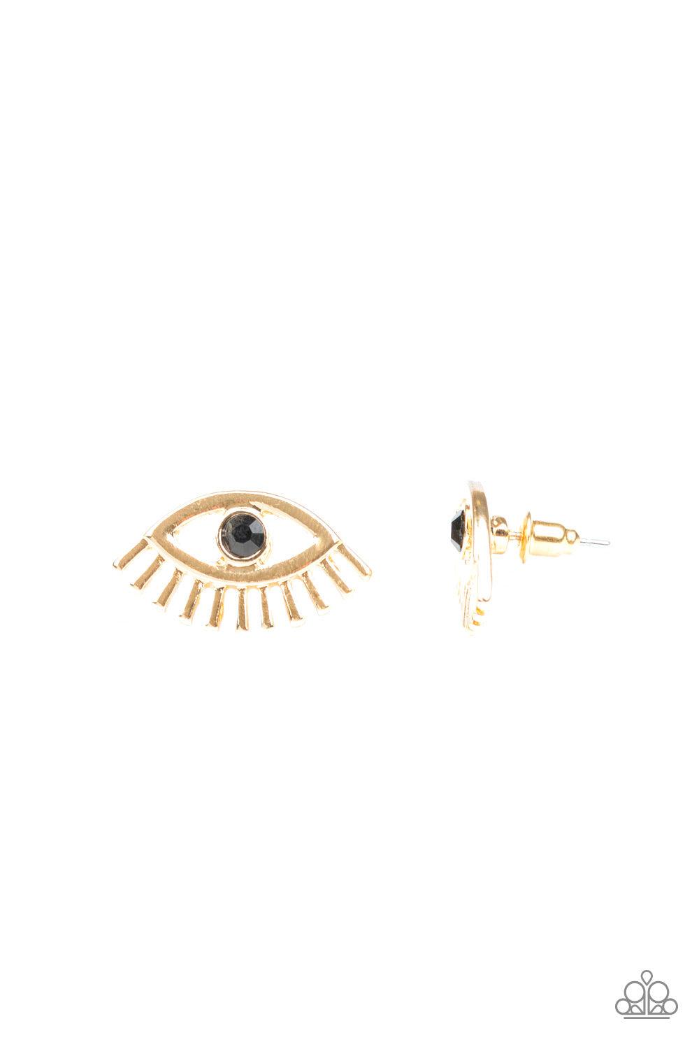 Paparazzi Accessories Don’t Blink - Gold A dainty black rhinestone is pressed into the center of a gold eye-shaped frame for a funky fashion. Earring attaches to a standard post fitting. Jewelry