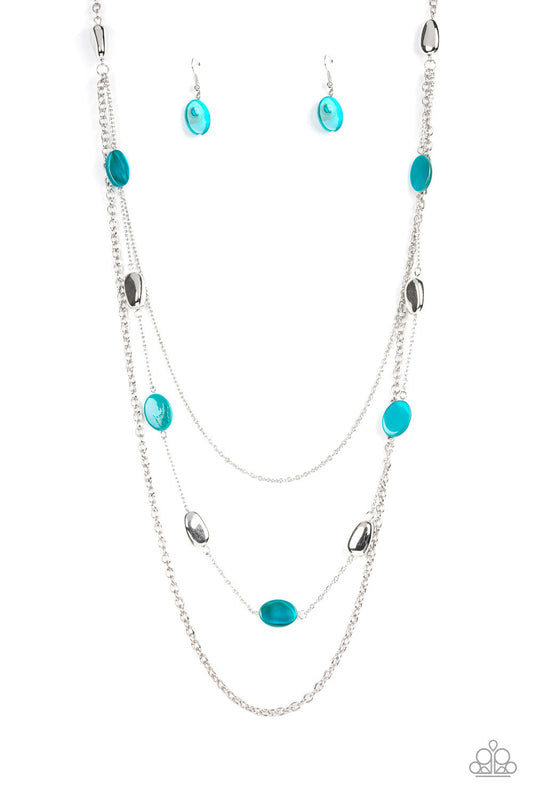 Paparazzi Accessories Barefoot And Beachbound - Blue A strand of silver pebble beads and blue shell-like discs layer with two mismatched silver chains across the chest, adding a seasonal pop of color to any outfit. Features an adjustable clasp closure. So