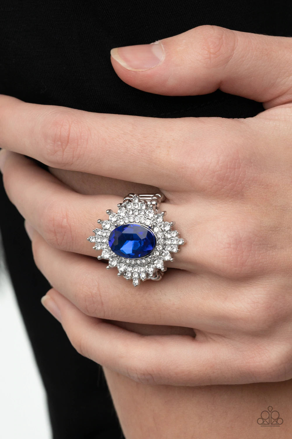 Paparazzi Accessories Five Star Stunner - Blue White rhinestone encrusted silver petals bloom out of an oversized French Blue oval gem bordered in an extra ring of white rhinestones, creating a glamorous floral centerpiece atop the finger. Features a stre