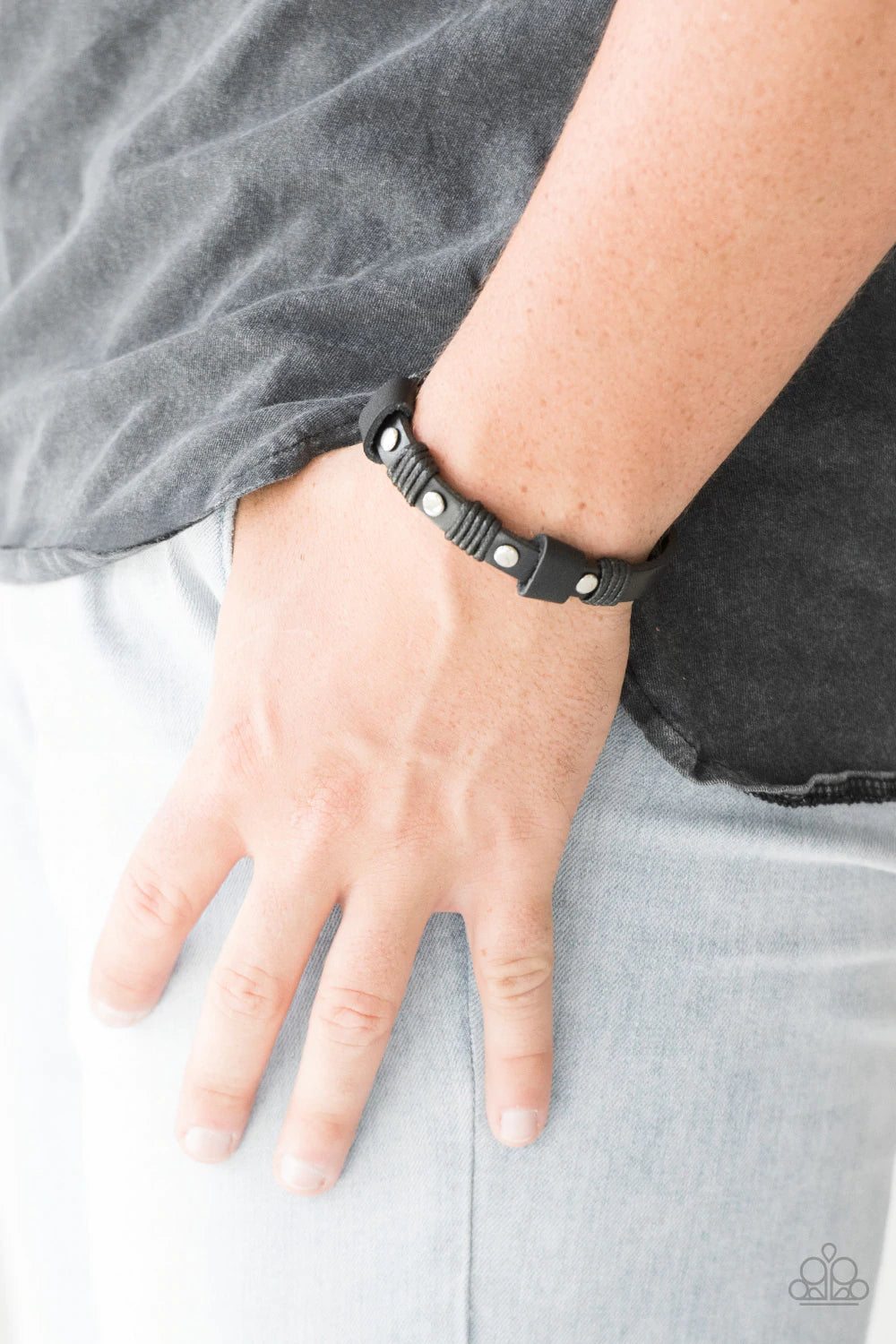 Paparazzi Accessories Road Burner - Black Infused with shimmery silver studs, strips of black twine and leather laces wrap around a black leather band for a rugged look. Features an adjustable snap closure. Sold as one individual bracelet. Jewelry