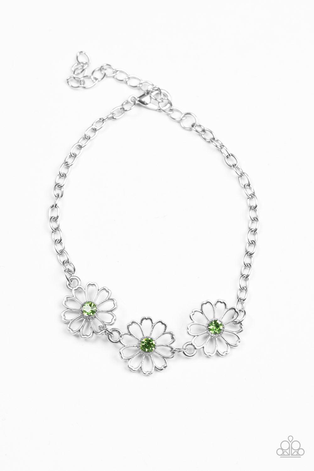 Paparazzi Accessories Dancing Daffodils - Green Stenciled silver floral charms link around the wrist. Glittery green rhinestones dot the dainty floral centers, adding a whimsical finish to the airy palette. Features an adjustable clasp closure. Sold as on