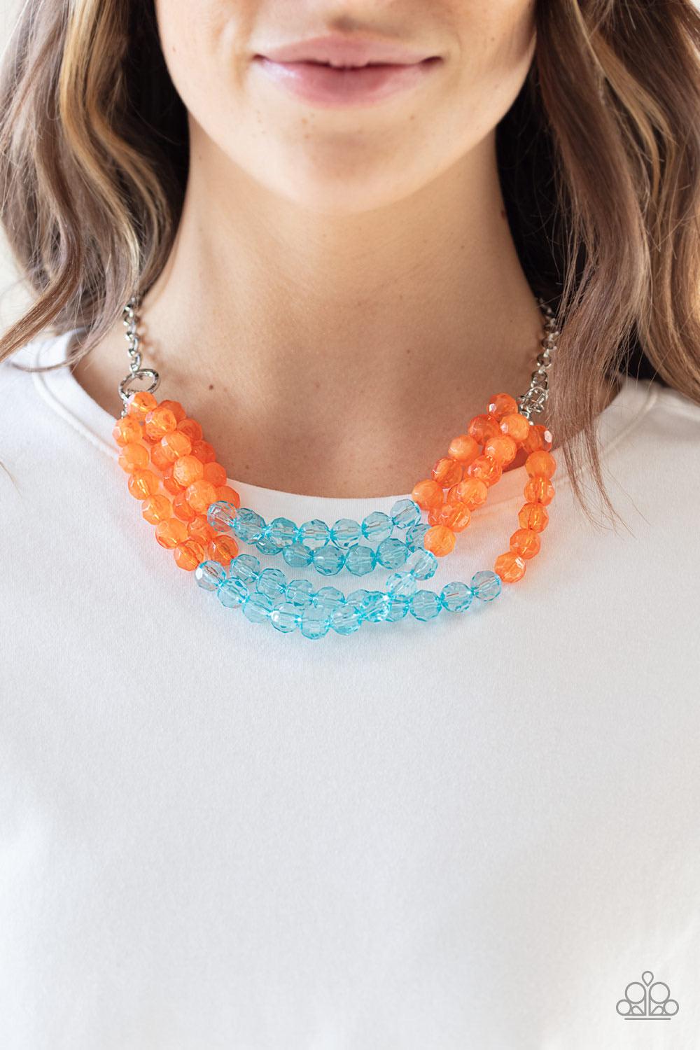 Paparazzi Accessories Summer Ice - Orange Featuring cloudy and glassy finishes, strands of faceted orange and blue crystal-like beads alternate below the collar, creating colorfully icy layers. Features an adjustable clasp closure. Jewelry