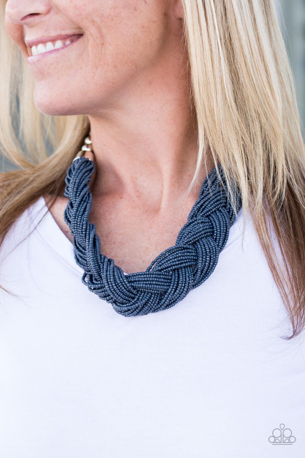 Paparazzi Accessories The Great Outback - Blue Brushed in the refreshing hue of Sargasso Sea, countless seed beads weave into an indigenous braid below the collar. The colorful strands attach to large silver beads, adding a hint of metallic shimmer to the
