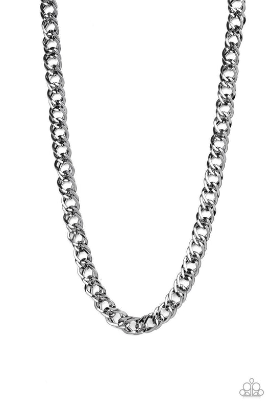 Paparazzi Accessories Undefeated - Black Featuring doubled links, a glistening gunmetal chain drapes across the chest for a bold look. Features an adjustable clasp closure. Sold as one individual necklace. Jewelry