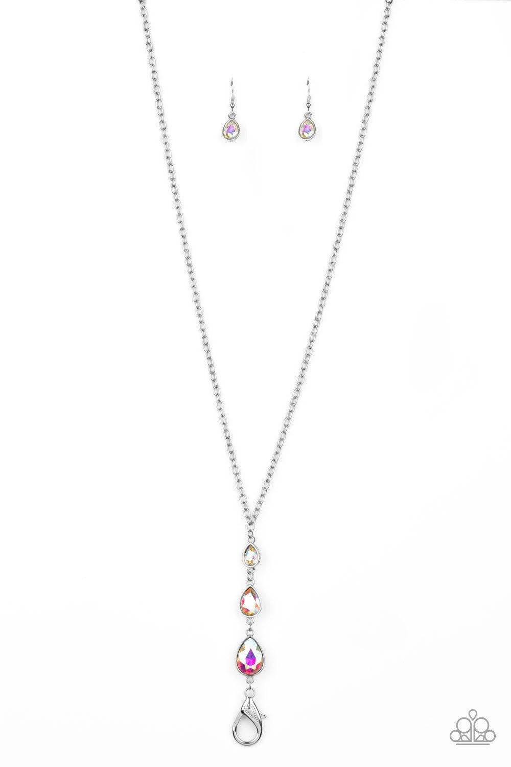 Paparazzi Accessories Don’t Mind If I Dew - Multi Featuring a rainbow iridescence, three glittery teardrop rhinestones gradually increase in size as they drip from the bottom of a lengthened silver chain. A lobster clasp hangs from the bottom of the desig