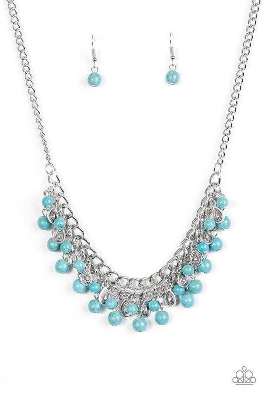 Paparazzi Accessories Poshly Paleo - Blue Earthy turquoise stone beading cascades from the bottom of interlocking silver chains, creating an earthy fringe below the collar. Brushed in an antiqued shimmer, textured silver teardrops drip between the colorfu