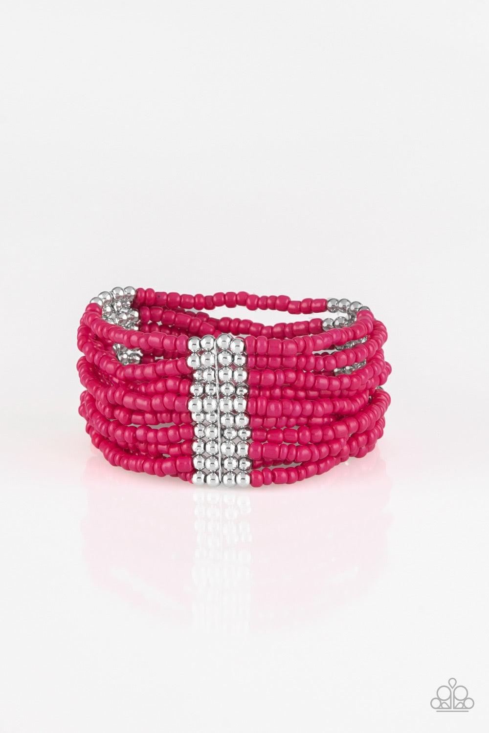 Paparazzi Accessories Outback Odyssey - Pink Joined together with metallic fittings, countless pink seed beads are threaded along stretchy elastic bands. Sections of dainty silver beads are sprinkled along the colorful layers, adding hints of shimmer to t