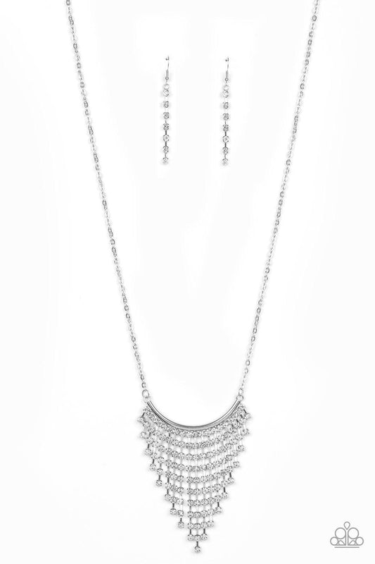 Paparazzi Accessories Glitter Bomb - White Chains of glittery white rhinestones stream from the bottom of a bowing silver bar, creating a tapered fringe at the bottom of a lengthened silver chain. Features an adjustable clasp closure. Sold as one individu