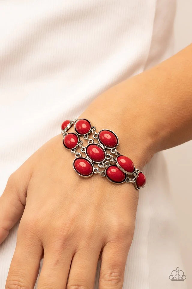Paparazzi Accessories Color Wheel Garden - Red A bracelet that's as delicate and pretty as a flower, the Color Wheel Garen bracelet is the perfect way to add a little color to your life. This silver bracelet features red oval beads that delicately link ac