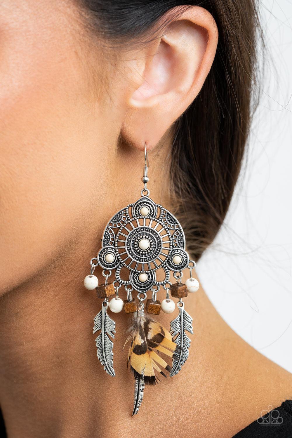 Paparazzi Accessories Desert Plains - White Radiating with studded patterns, a white stone dotted silver frame gives way to a whimsical collection of silver feather charms, wooden cube beads, refreshing white stones, and a brown feather, creating a whimsi