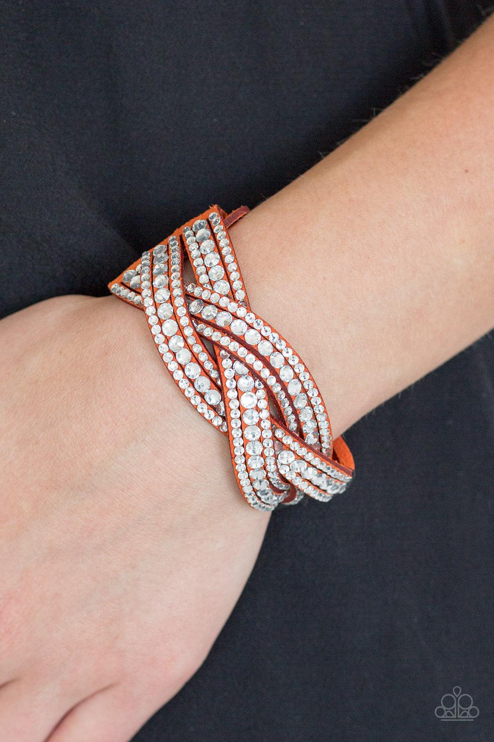 Paparazzi Accessories Bring on the Bling - Orange Varying in size, glassy white rhinestones are encrusted along interwoven orange suede bands, creating blinding shimmer across the wrist. Features an adjustable snap closure. Sold as one individual bracelet