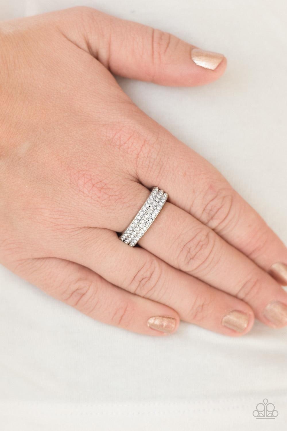 Paparazzi Accessories Turn The Other CHIC - White Featuring a slightly raised center, three shimmery silver bars coalesce into a dainty band. Rows of glassy white rhinestones are encrusted along the band, adding a refined finish to the classic palette. Fe