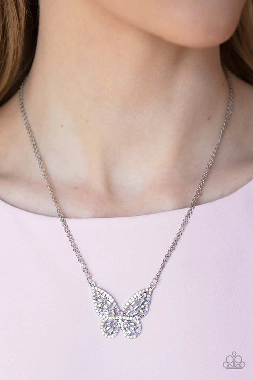 Paparazzi Accessories Baroque Butterfly - Multi Bordered in iridescent rhinestones, an airy silver butterfly is dotted in dainty iridescent rhinestones and shiny silver emerald-like accents as it flutters from two chains below the collar for an enchanting