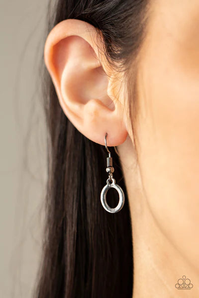 Paparazzi Accessories Working Oval Time - Black A shiny series of glistening gunmetal discs and oval frames delicately link below the collar, creating a casual statement. Features an adjustable clasp closure. Sold as one individual necklace. Includes one