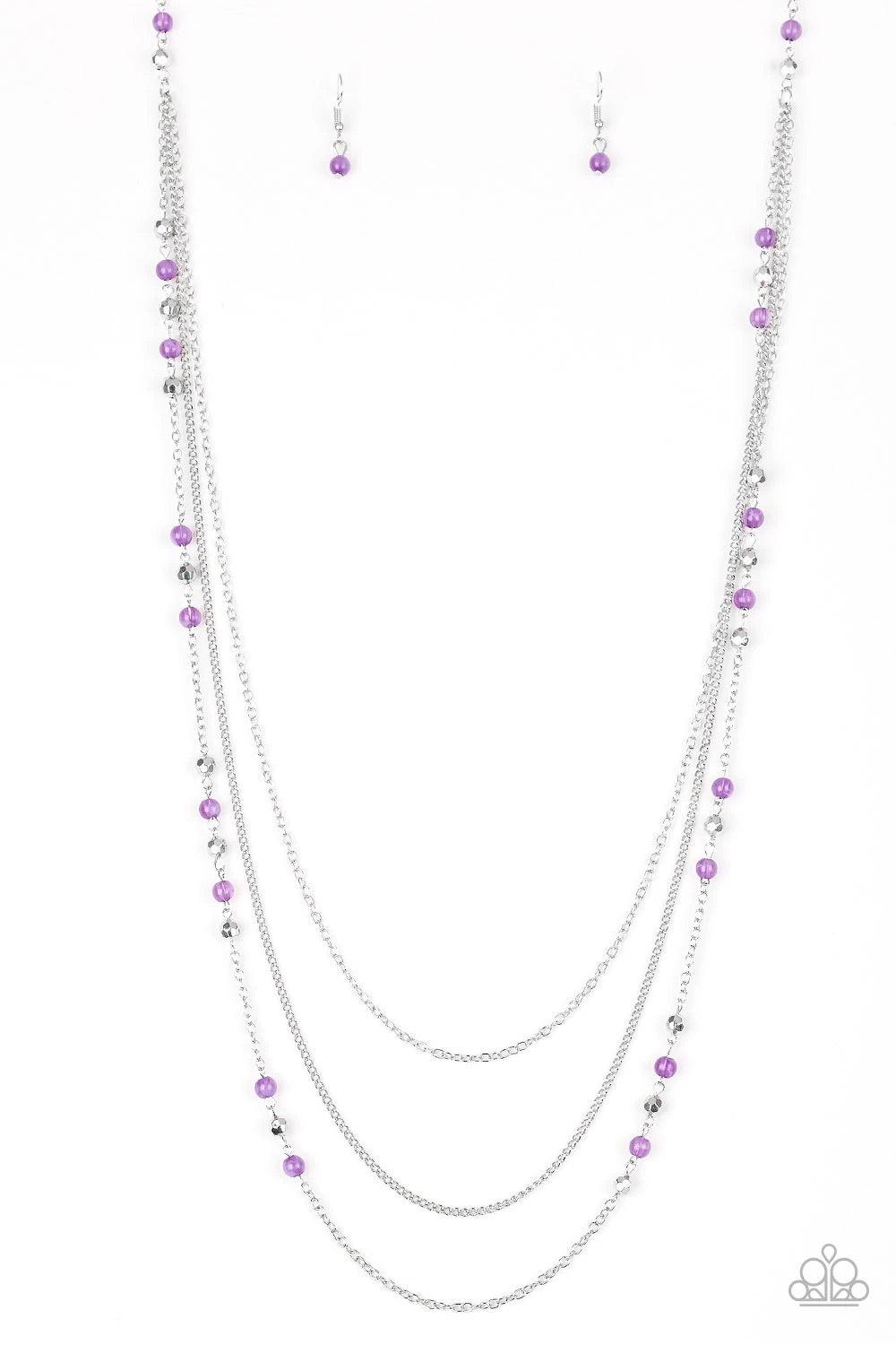 Paparazzi Accessories Colorful Cadence - Purple Faceted silver and glassy purple beads trickle along shimmery silver chains down the chest for a whimsical look. Features an adjustable clasp closure. Sold as one individual necklace. Includes one pair of ma