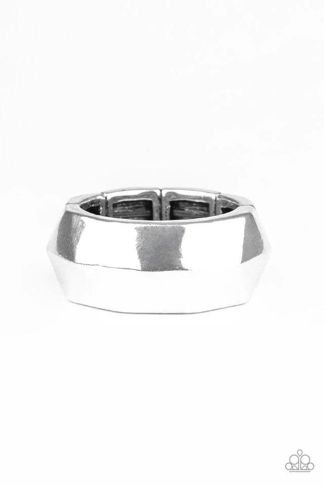 Paparazzi Accessories Industrial Mechanic - Silver Featuring an edgy geometric faceted surface, a thick silver band arcs across the finger. Features a stretchy band for a flexible fit. Jewelry